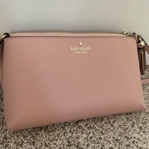 light pink kate spade with rose gold tassels on zipper!